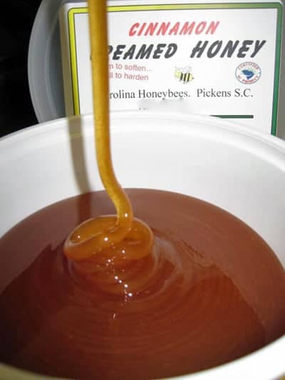 Raw honey that has crystallized or turned to sugar fast to form creamed honey image.