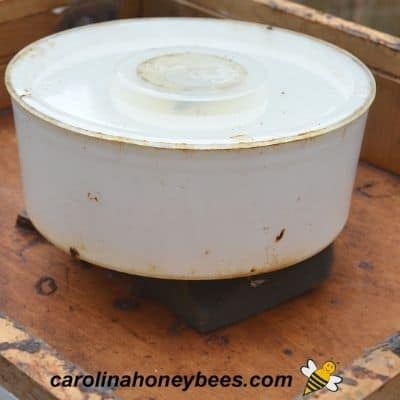 White feeder for feeding colony in late summer or fall inside the hive.