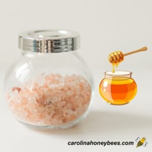 Jar of pink sea salt and honey to make a bath soak recipe image.