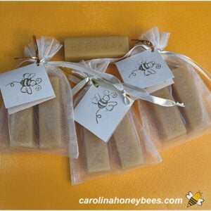 Trio of beeswax sewing cakes in gift bags image.