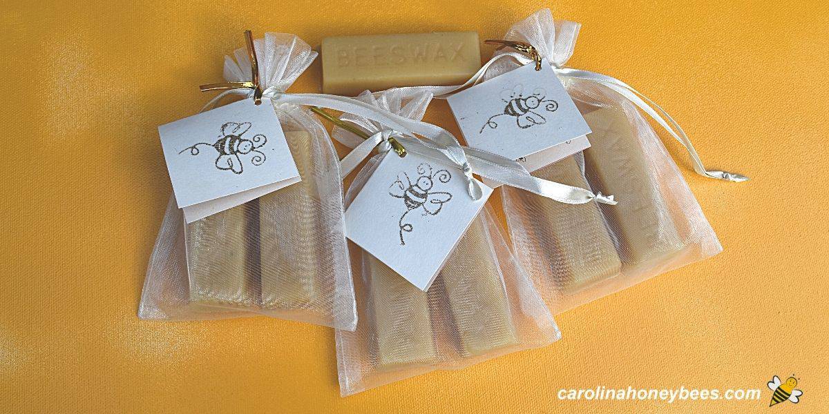 Trio of beeswax sewing cakes in gift bags image.