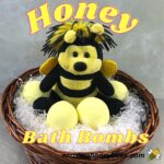 Cute bee bear with honey bath bombs in basket image.