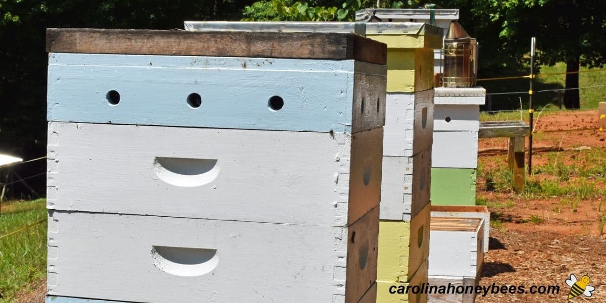 Stacked boxes on Langstroth hives ready to be collected by the beekeeper.