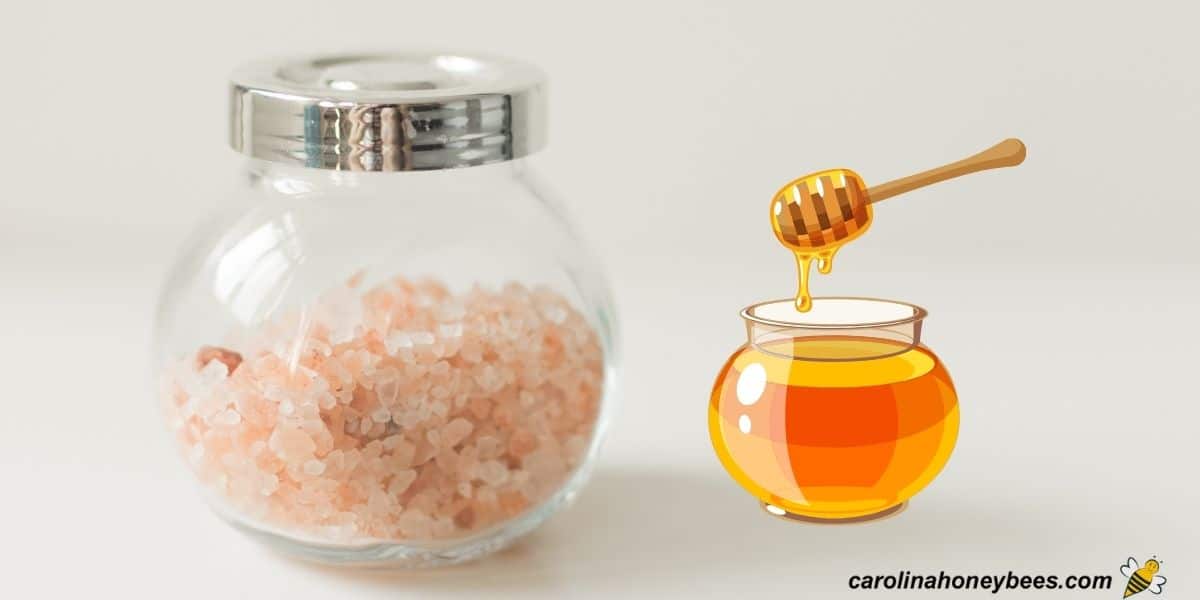 Jar of pink sea salt and honey to make a natural salt scrub. 