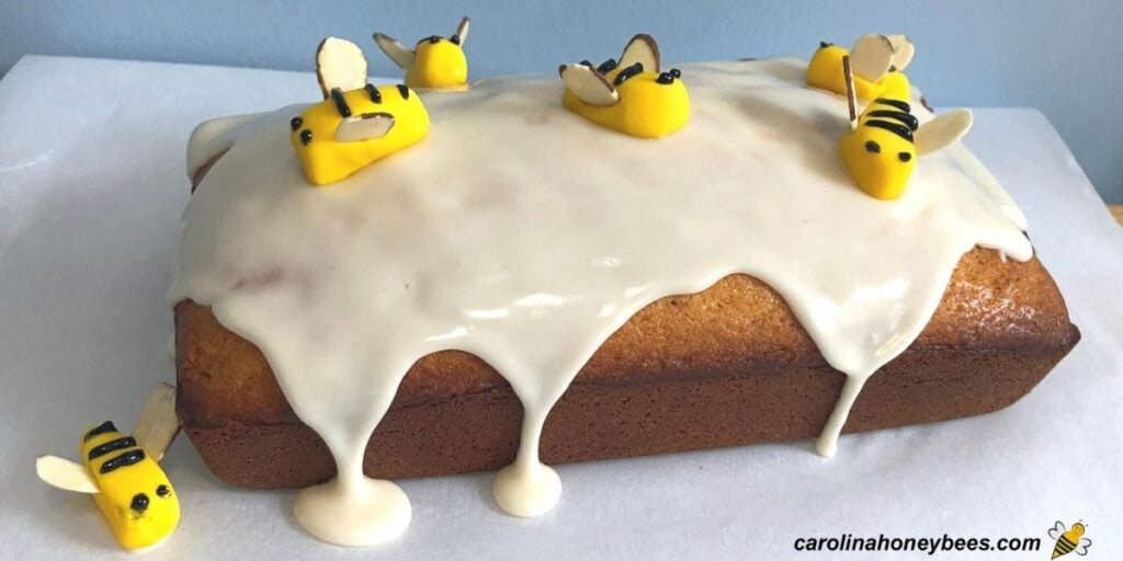 Homemade honey bee cake with fondant bees on top image.
