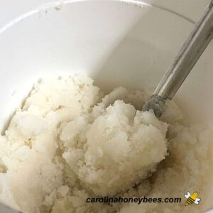Water and granulated sugar for cakes for bee food.