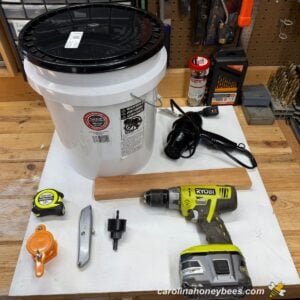 Materials used to make a gated honey bucket from a plastic pail.